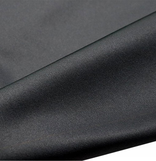 A close-up view of a textured black fabric, showcasing its intricate weave and rich color depth.