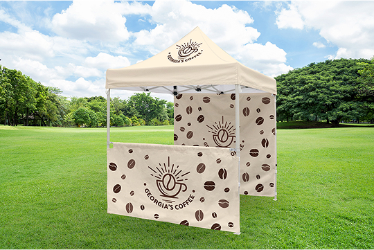 A coffee shop tent featuring a decorative design of coffee beans, inviting customers to enjoy their favorite brews.