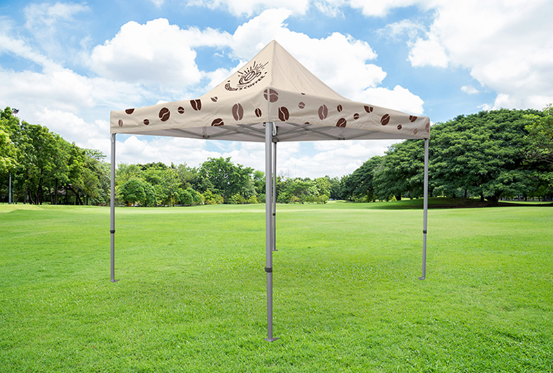A tent featuring a coffee cup design, showcasing a playful and cozy camping aesthetic.
