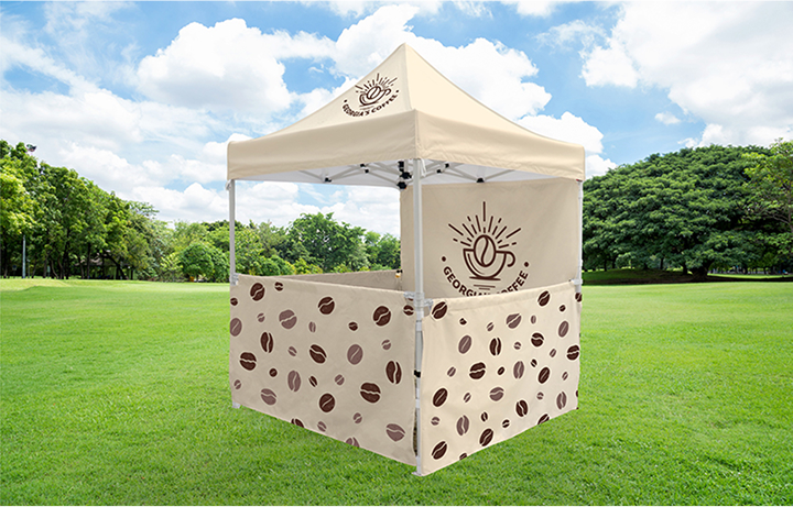 A coffee bean tent featuring a brown and white design, showcasing a cozy and inviting outdoor space.