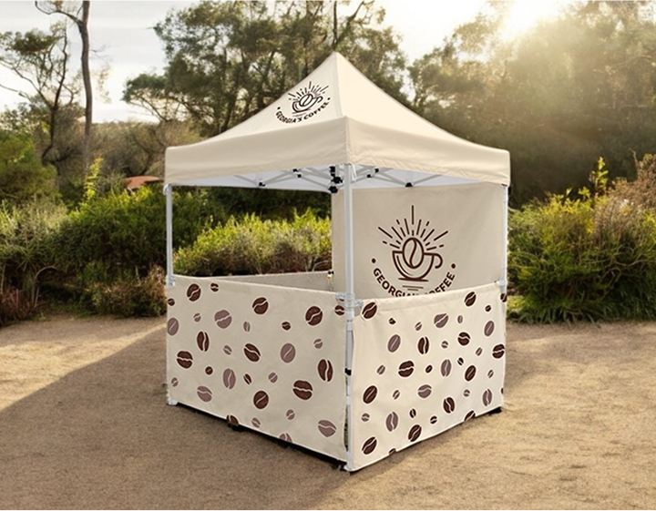 Coffee tent featuring a coffee bean design, set up outdoors, inviting customers to enjoy freshly brewed coffee.